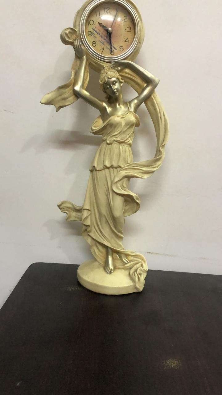 Rajani Shantaram Pandit artistic woman statue with vintage clock